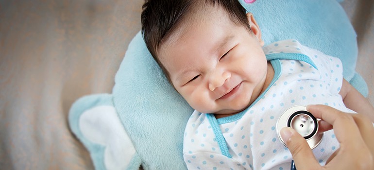 Baby being examined by a doctor