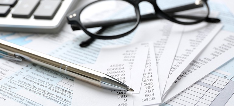 Pen and glasses on a table