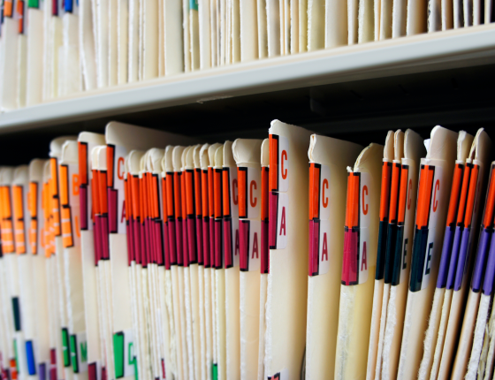 shelf of filed medical folders