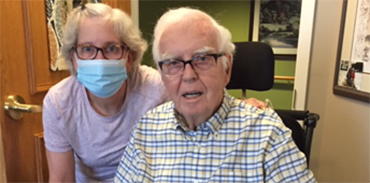 Dr. Kim Plaxton in mask with her father
