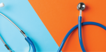 stethoscope on light blue and bright orange backgroun